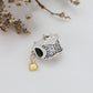 Gold love tassel pendant