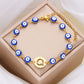 Women's High-grade Stainless Steel Blue Eyes Fashion Hollowed-out 26 Letter Bracelet