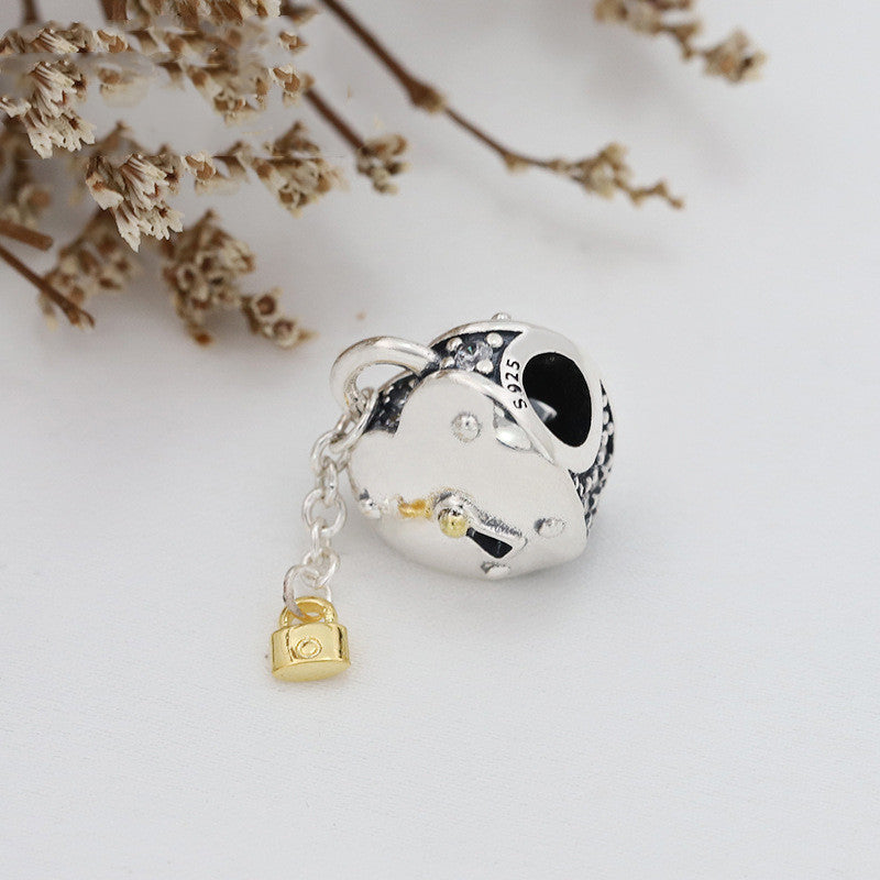 Gold love tassel pendant