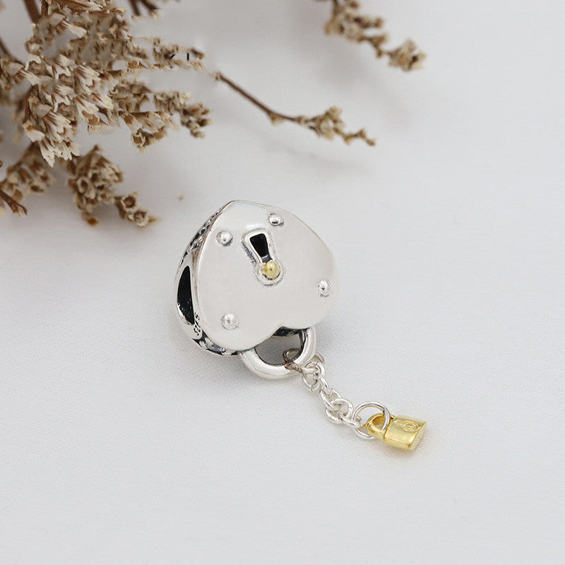 Gold love tassel pendant
